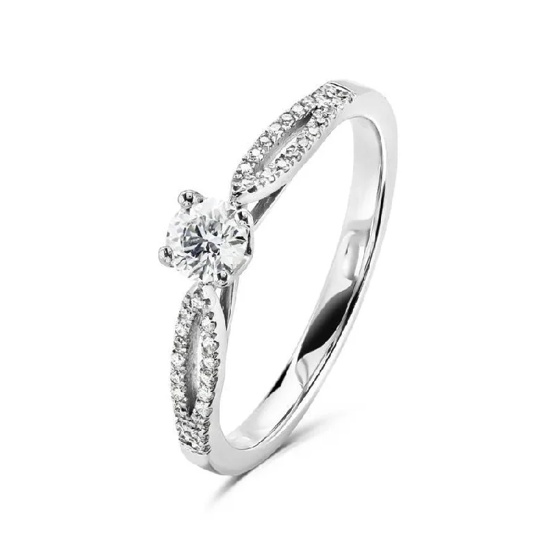 Platinum 4 claw set round brilliant cut Diamond solitaire ring with split claw set Diamond shoulders